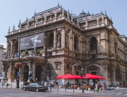 people walking near brown concrete building during daytime